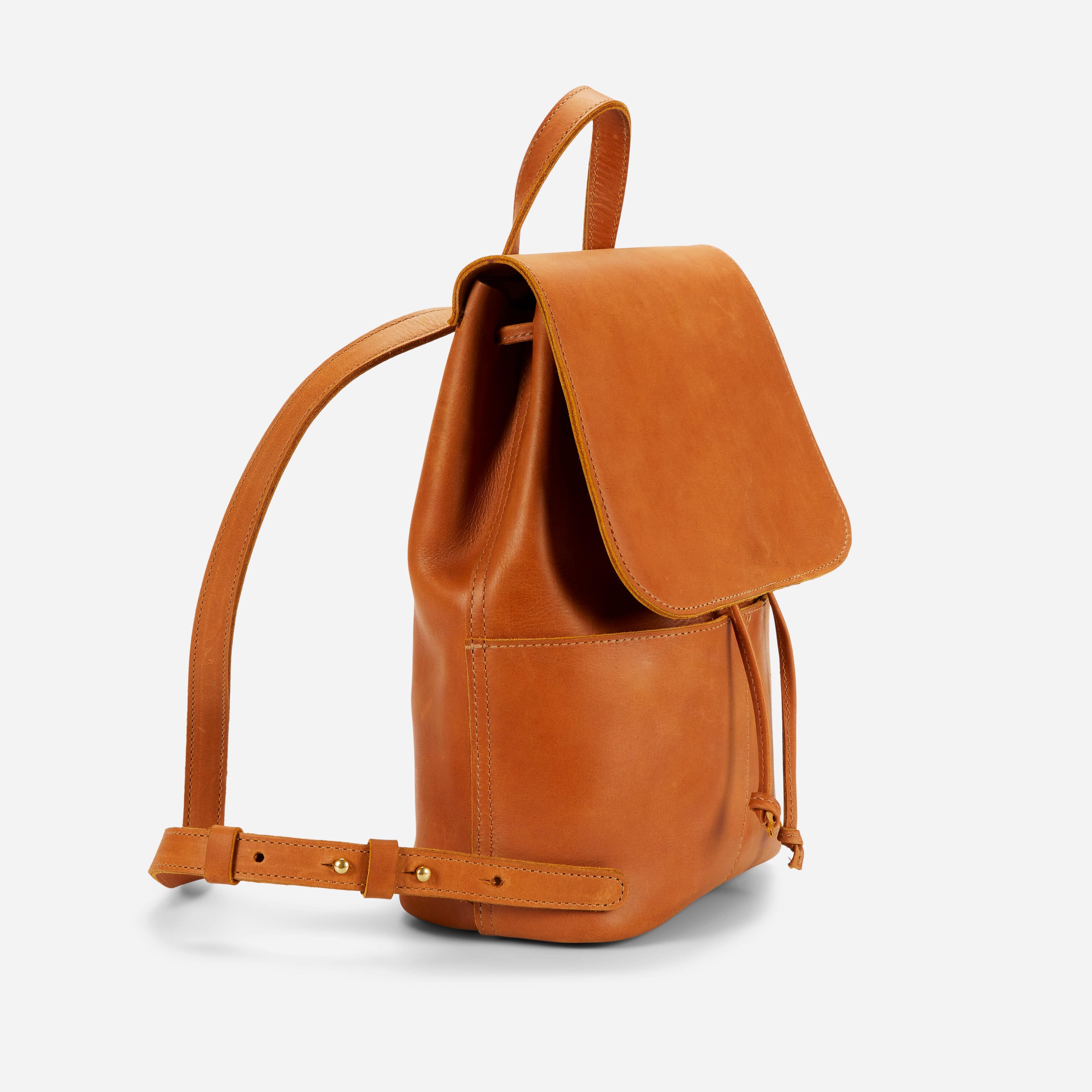 bucket style leather backpack Harper Buckle Pocket - Black worked grain to the solid brass buckle that adjusts the strap from shoulder to crossbody Full-Grain Goat Leather Bucket Bag