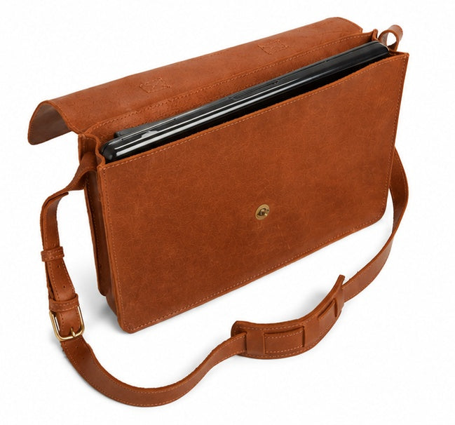 boxy, single-compartment brief with a top grab handle plus optional shoulder strap