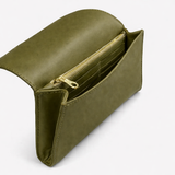 Salome foldover clutch in olive open showing gold-zip pocket and card slots interior
