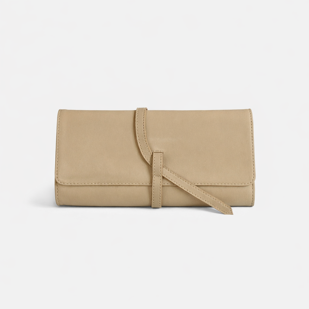 Parker Clay Salome full-grain leather foldover clutch in sand, exterior view showing wraparound tie strap